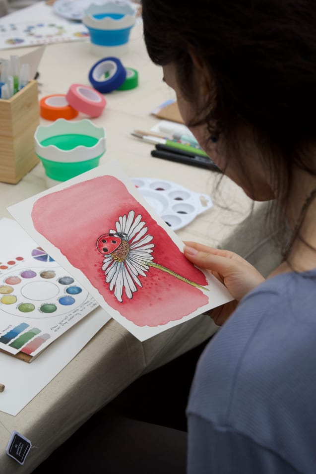 Gabriela sketching in her studio